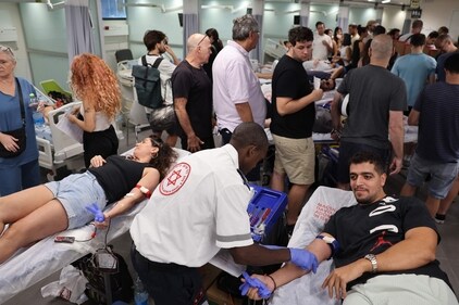Israelis donate blood at a hospital in Tel Aviv on October 7, 2023, after a barrage of rockets were fired and fighters from the Gaza Strip infiltrated Israel, (AFP) Israelis donate blood at a hospital in Tel Aviv on October 7, 2023, after a barrage of rockets were fired and fighters from the Gaza Strip infiltrated Israel, (AFP)