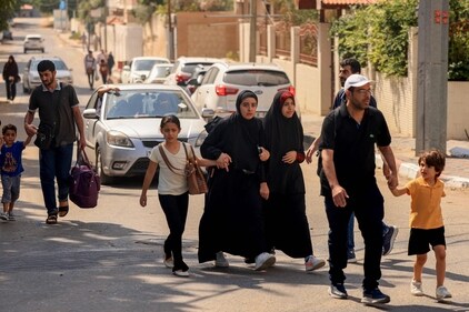 Palestinians move to safer areas following overnight Israeli shelling in Gaza City on October 10. (AFP) Palestinians move to safer areas following overnight Israeli shelling in Gaza City on October 10. (AFP)