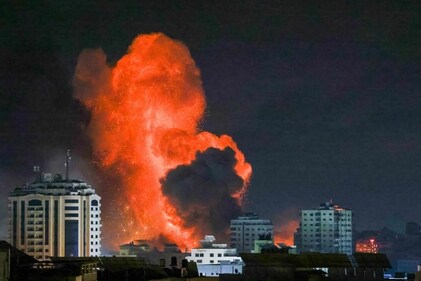 A fireball erupts from an Israeli airstrike in Gaza City on October 9, 2023. (AFP) A fireball erupts from an Israeli airstrike in Gaza City on October 9, 2023. (AFP)