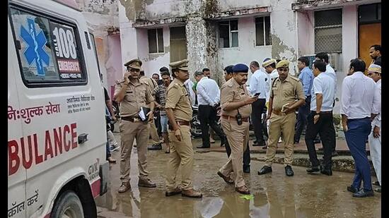 Police personnel investigate after six people including five of a family were killed over a property dispute, in Deoria district on Oct 2. (PTI Photo)