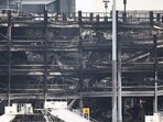 A charred section of a parking structure is seen after it caught fire and partially collapsed at London's Luton Airport. (AFP) A charred section of a parking structure is seen after it caught fire and partially collapsed at London's Luton Airport. (AFP)