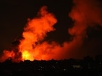 Explosions illuminate the sky during Israeli strikes on Gaza City on October 10, 2023. (Photo by MAHMUD HAMS / AFP) Explosions illuminate the sky during Israeli strikes on Gaza City on October 10, 2023. (Photo by MAHMUD HAMS / AFP)