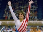 Mary Lou Retton reacts to applause after her performance at the Summer Olympics in Los Angeles on Aug. 3, 1984. Retton. 55, is in intensive care in a Texas hospital fighting a rare form of pneumonia, according to her daughter McKenna Kelley. (AP Photo/Suzanne Vlamis, File) Mary Lou Retton reacts to applause after her performance at the Summer Olympics in Los Angeles on Aug. 3, 1984. Retton. 55, is in intensive care in a Texas hospital fighting a rare form of pneumonia, according to her daughter McKenna Kelley. (AP Photo/Suzanne Vlamis, File)