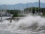 Waves crash against an ocean pier in Mexico's Pacific coast, in Puerto Vallarta.