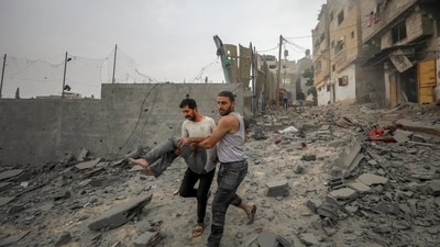Palestinians evacuate wounded in Israeli aerial bombing on Jabaliya, near Gaza City. (AP) Palestinians evacuate wounded in Israeli aerial bombing on Jabaliya, near Gaza City. (AP)