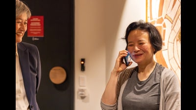 Australian journalist Cheng Lei speaks on the phone, on arrival at Melbourne Airport in Melbourne, October 11, 2023. AAP Image/Supplied by the Department of Foreign Affairs and Trade (DFAT) via REUTERS ATTENTION EDITORS - THIS IMAGE WAS PROVIDED BY A THIRD PARTY. NO RESALES. NO ARCHIVE. AUSTRALIA OUT. NEW ZEALAND OUT (via REUTERS)