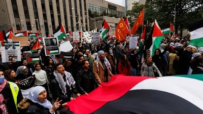 Demonstrators in support of Palestinians wave Palestinian flags during a protest in Toronto, Ontario, Canada, on October 9, 2023. (AFP) Demonstrators in support of Palestinians wave Palestinian flags during a protest in Toronto, Ontario, Canada, on October 9, 2023. (AFP)