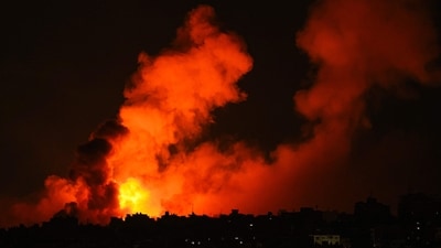 Explosions illuminate the sky during Israeli strikes on Gaza City on October 10, 2023. (Photo by MAHMUD HAMS / AFP) (AFP) Explosions illuminate the sky during Israeli strikes on Gaza City on October 10, 2023. (Photo by MAHMUD HAMS / AFP) (AFP)