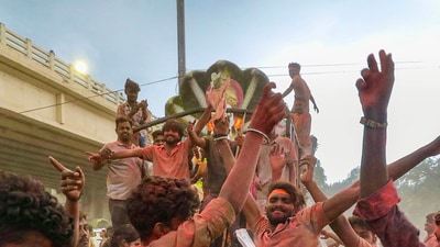Devotees dance during a Lord Ganesha idol procession. (Representational image) (PTI) Devotees dance during a Lord Ganesha idol procession. (Representational image) (PTI)