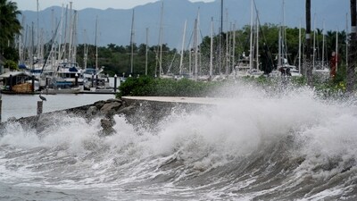 Waves crash against an ocean pier in Mexico's Pacific coast, in Puerto Vallarta. (REUTERS)