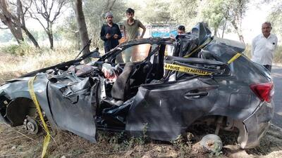 The mangled remains of the car after it rammed into a truck parked on the roadside near Sherla village in Bhiwani district on Tuesday night. All five car occupants died in the accident. (HT photo)