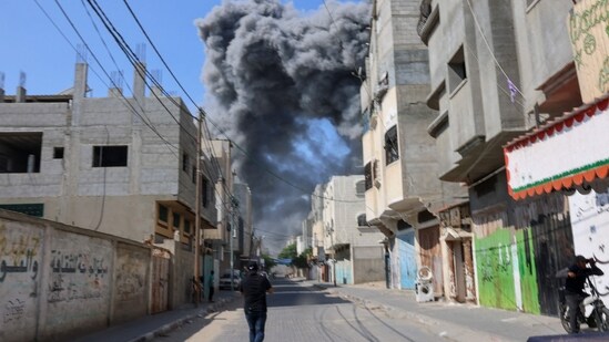 Israel-Palestine war LIVE: Smoke billows behind buildings after after an Israeli air strike in Rafah in the southern Gaza Strip. (AFP)
