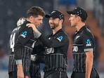 New Zealand's Mitchell Santner (L) celebrates a wicket. New Zealand's Mitchell Santner (L) celebrates a wicket.