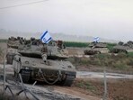 A convoy of Israeli tanks advances near the border with Gaza A convoy of Israeli tanks advances near the border with Gaza