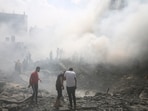 Palestinians look for survivors after an Israeli airstrike in Rafah refugee camp, southern Gaza Strip.