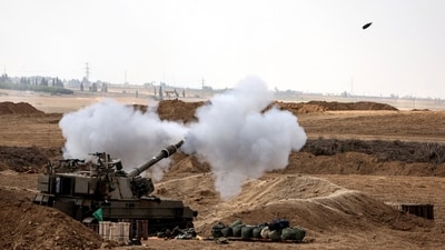 An Israeli tank fires near the border with the Gaza Strip, in southern Israel, Israel's government has responded by putting the enclave, home to 2.3 million people, under total siege and launching by far the most powerful bombing campaign in the 75-year history of the Israeli-Palestinian conflict, destroying whole neighborhoods, reported Reuters. (Ronen Zvulun/ REUTERS) An Israeli tank fires near the border with the Gaza Strip, in southern Israel, Israel's government has responded by putting the enclave, home to 2.3 million people, under total siege and launching by far the most powerful bombing campaign in the 75-year history of the Israeli-Palestinian conflict, destroying whole neighborhoods, reported Reuters. (Ronen Zvulun/ REUTERS)