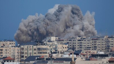 Smoke rises following an Israeli airstrike in Gaza City, (AP) Smoke rises following an Israeli airstrike in Gaza City, (AP)