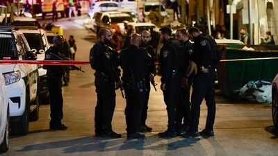 Israeli police secure the scene following reports of gunfire directed at Shalem police station near the Old City of Jerusalem, (REUTERS)
