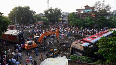 Rescuers and other gather around coaches of the North-East Express passenger train that derailed late Wednesday near Raghunathpur railroad station in Buxar district of Bihar (AP) Rescuers and other gather around coaches of the North-East Express passenger train that derailed late Wednesday near Raghunathpur railroad station in Buxar district of Bihar (AP)