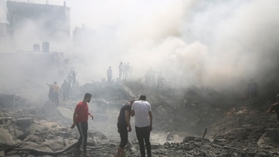 Palestinians look for survivors after an Israeli airstrike in Rafah refugee camp, southern Gaza Strip. (AP) Palestinians look for survivors after an Israeli airstrike in Rafah refugee camp, southern Gaza Strip. (AP)