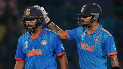 Virat Kohli pats Rohit Sharma after the India captain was dismissed for an entertaining 131 against Afghanistan in their World Cup match. (PTI)