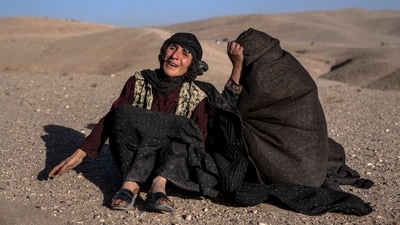 Afghan women mourn relatives killed in an earthquake at a burial site after an earthquake in Zenda Jan district in Herat province, western of Afghanistan. (AP)