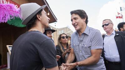 Prime Minister Justin Trudeau (front right) greets a vendor during a stop in downtown Kitchener, Ontario, for the start of Oktoberfest, on October 6, 2023. (AP) Prime Minister Justin Trudeau (front right) greets a vendor during a stop in downtown Kitchener, Ontario, for the start of Oktoberfest, on October 6, 2023. (AP)