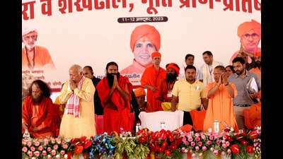 RSS chief Mohan Bhagwat, yoga guru Ramdev and Uttar Pradesh chief minister Yogi Adityanath at a religious function in Rohtak on Thursday. (Manoj Dhaka/HT)