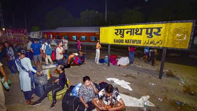 Stranded passengers at Raghunathpur railway station. (PTI) Stranded passengers at Raghunathpur railway station. (PTI)