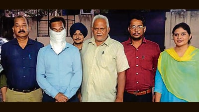 The accused in the custody of VB officials in Ludhiana on Thursday. (HT Photo) The accused in the custody of VB officials in Ludhiana on Thursday. (HT Photo)