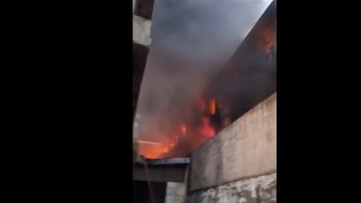 Fire erupts in a factory near Peeragarhi Metro Station in Delhi. (PTI / video screengrab)