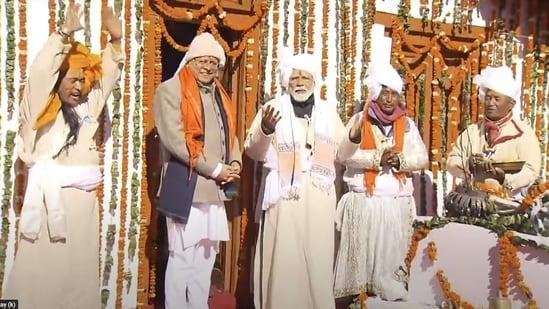PM Modi and Uttarakhand Chief Minister Pushkar Singh Dhami at Parvati Kund, in Pithoragarh. PM Modi was seen donning a traditional tribal attire, which included a turban and 'ranga' (upper body garment).(PTI)