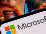 FILE PHOTO: Microsoft logo is seen on a smartphone placed on displayed Activision Blizzard's games characters in this illustration taken January 18, 2022. REUTERS/Dado Ruvic/Illustration/File Photo