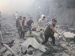 Palestinians evacuate wounded after an Israeli airstrike in Rafah refugee camp in southern Gaza Strip on October 12. Palestinians evacuate wounded after an Israeli airstrike in Rafah refugee camp in southern Gaza Strip on October 12.