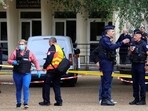 French police and fire fighters work after a teacher was killed and several people injured in a knife attack 