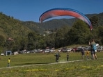 Paragliders during Shimla flying festival at Junga on Thursday. (PTI) Paragliders during Shimla flying festival at Junga on Thursday. (PTI)