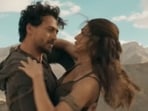 Tiger Shroff and Kriti Sanon in stills from Ganapath: A Hero is Born. Tiger Shroff and Kriti Sanon in stills from Ganapath: A Hero is Born.