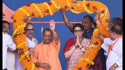 Chief minister Yogi Adityanath and Amethi MP and Union minister Smriti Irani being garlanded during distribution of prizes to the winners of ‘MP Sports Competition-2023’, in Amethi, Friday. (PTI Photo) Chief minister Yogi Adityanath and Amethi MP and Union minister Smriti Irani being garlanded during distribution of prizes to the winners of ‘MP Sports Competition-2023’, in Amethi, Friday. (PTI Photo)