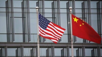 Chinese and US flags flutter outside the building of an American company in Beijing. (REUTERS) Chinese and US flags flutter outside the building of an American company in Beijing. (REUTERS)