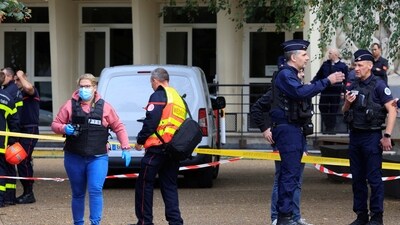 French police and fire fighters work after a teacher was killed and several people injured in a knife attack (REUTERS)