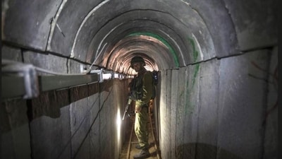 A 2014 photo of an Israeli army officer during an army-organised tour for journalists in a tunnel said to be used by Palestinian militants for cross-border attacks, (Reuters)