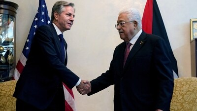 US Secretary of State Antony Blinken shaking hands with Palestinian President Mahmoud Abbas in Jordan on Friday. (via REUTERS)