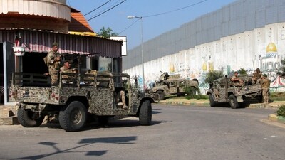 Lebanese army members are stationed in Kfar Kila, near the border with Israel. (REUTERS)