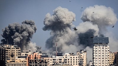 TOPSHOT - Smoke plumes billow during Israeli air strikes in Gaza City on October 12, 2023. (AFP) TOPSHOT - Smoke plumes billow during Israeli air strikes in Gaza City on October 12, 2023. (AFP)