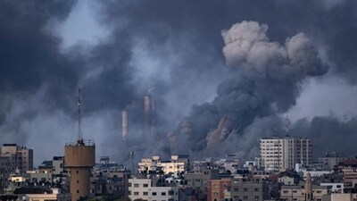 Smoke rises following an Israeli airstrike in Gaza City as Israeli warplanes pummel Gaza to avenge the Hamas attack. (AP) Smoke rises following an Israeli airstrike in Gaza City as Israeli warplanes pummel Gaza to avenge the Hamas attack. (AP)