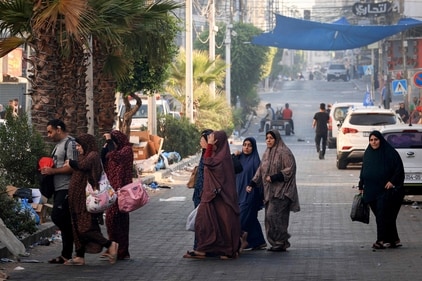 Palestinians flee to safer areas in Gaza City after Israeli air strikes, on October 13, 2023. (AFP) Palestinians flee to safer areas in Gaza City after Israeli air strikes, on October 13, 2023. (AFP)