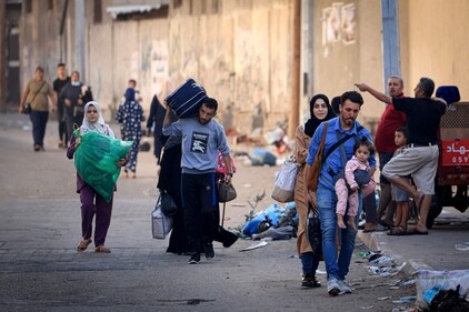 Palestinians with their belongings flee to safer areas in Gaza City after Israeli air strikes on October 13. (AFP) Palestinians with their belongings flee to safer areas in Gaza City after Israeli air strikes on October 13. (AFP)