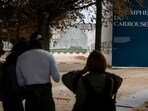 People wait outside the Louvre Museum as the place is evacuated after it received a written threat, in Paris. People wait outside the Louvre Museum as the place is evacuated after it received a written threat, in Paris.