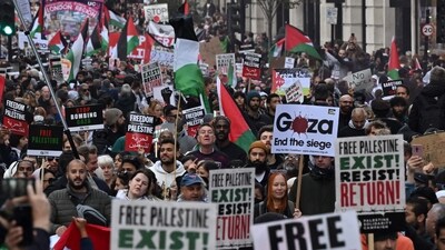Israel-Hamas War: People walk down Regent Street as they take part in a 'March For Palestine', part of a pro-Palestinian national demonstration, in London. (AFP) Israel-Hamas War: People walk down Regent Street as they take part in a 'March For Palestine', part of a pro-Palestinian national demonstration, in London. (AFP)