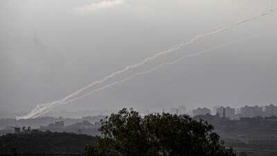 A picture taken from the Israeli city of Sderot shows rockets being fired towards Israel from the northern Gaza Strip on October 14, 2023. (AFP) A picture taken from the Israeli city of Sderot shows rockets being fired towards Israel from the northern Gaza Strip on October 14, 2023. (AFP)